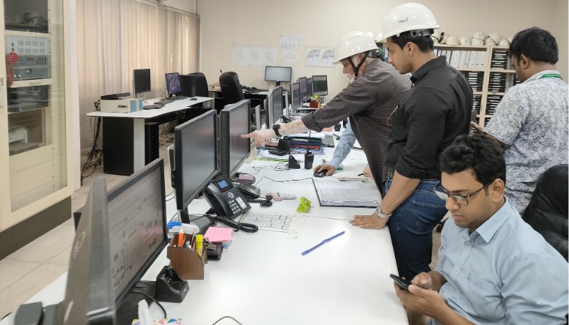 utility workers in a control room